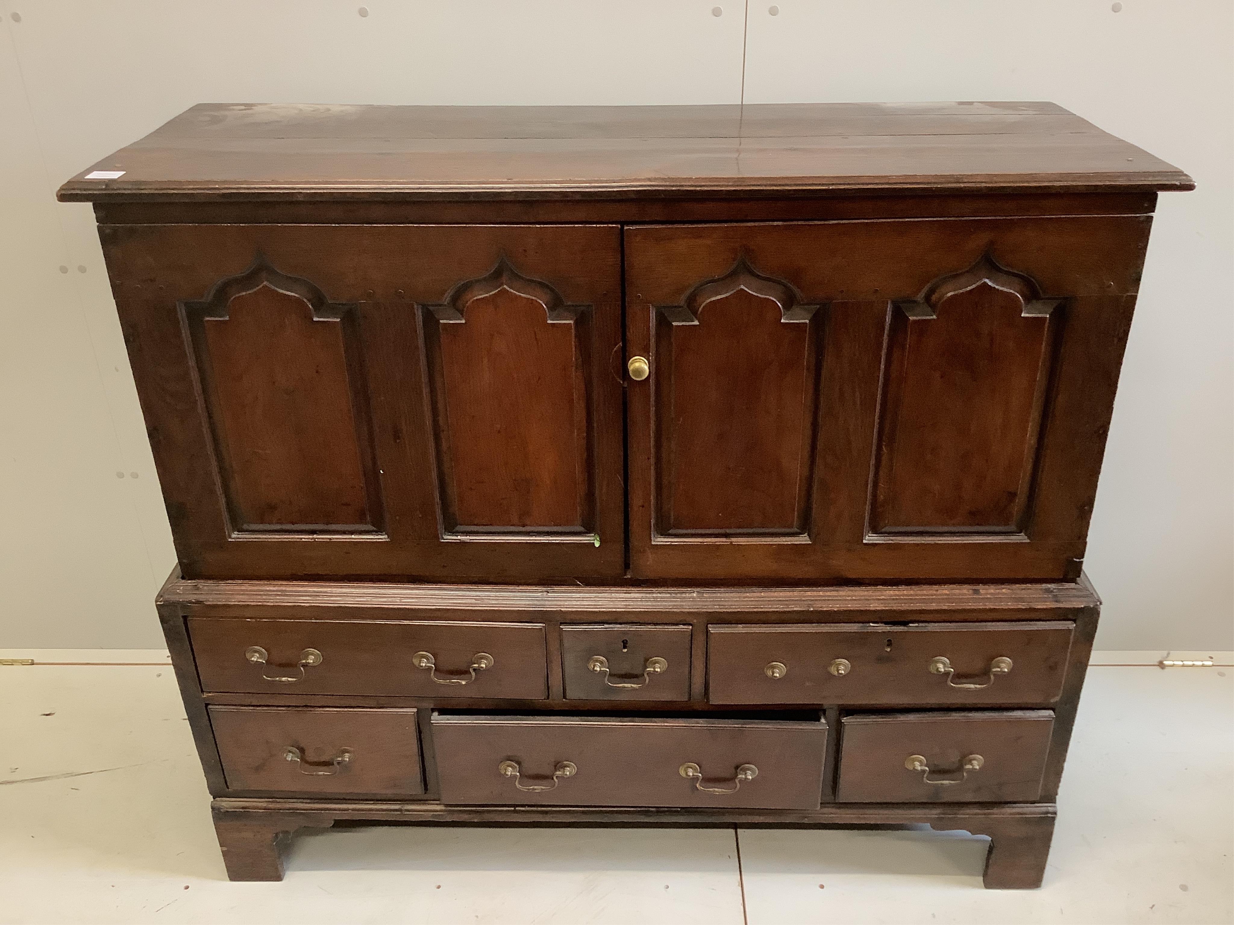 An 18th century oak mule chest, width 141cm, depth 52cm, height 122cm. Condition - fair